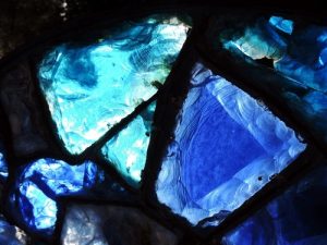 Fragment,of,broken,blue,stained Glass,window.,macro,photo